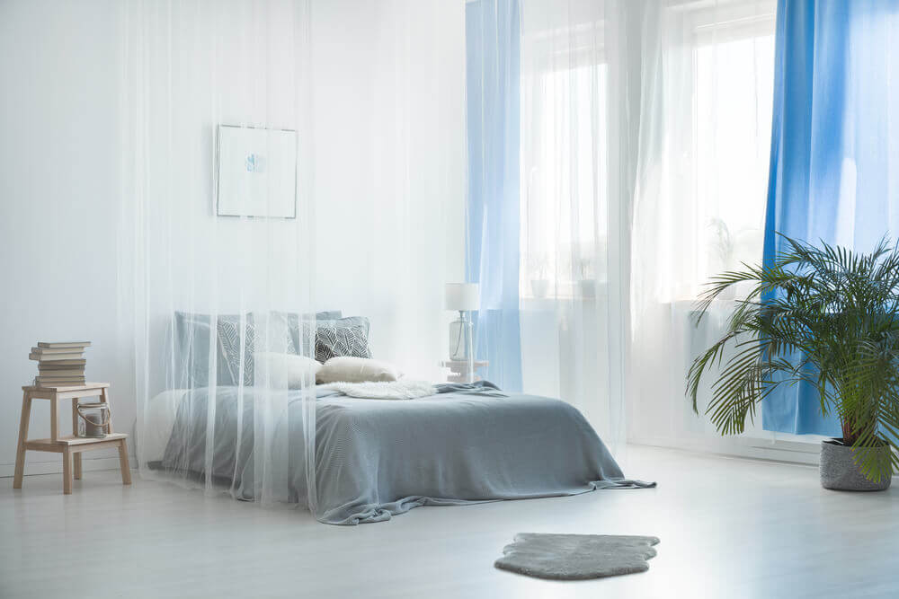 sheer curtains around bed