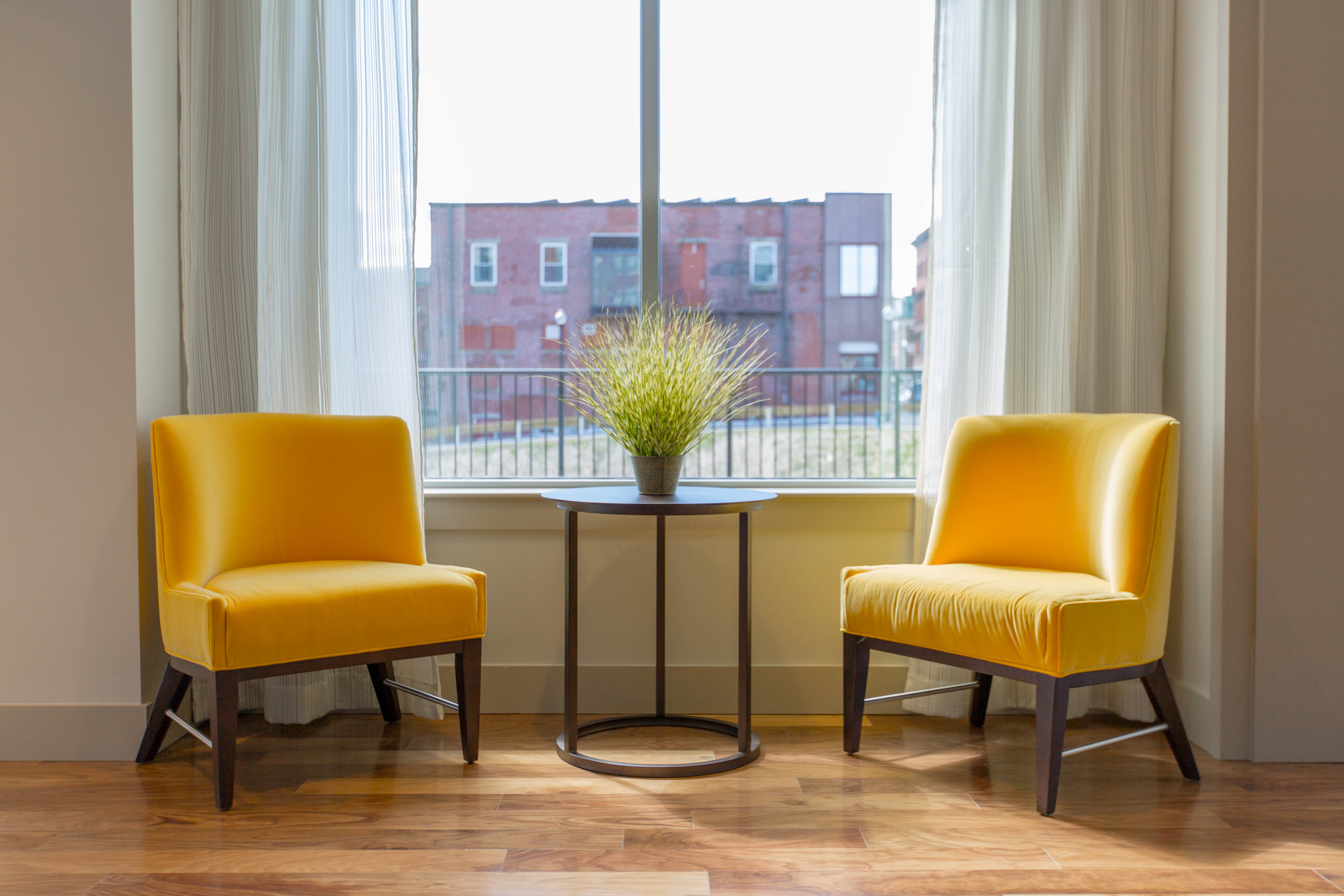 yellow chairs at window