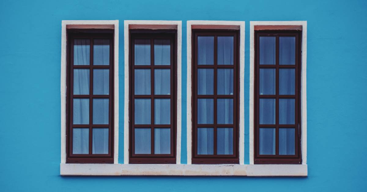 blue wall with brown windows